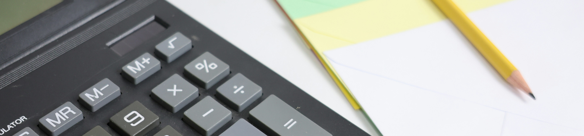 Calculator, pages, and a pencil